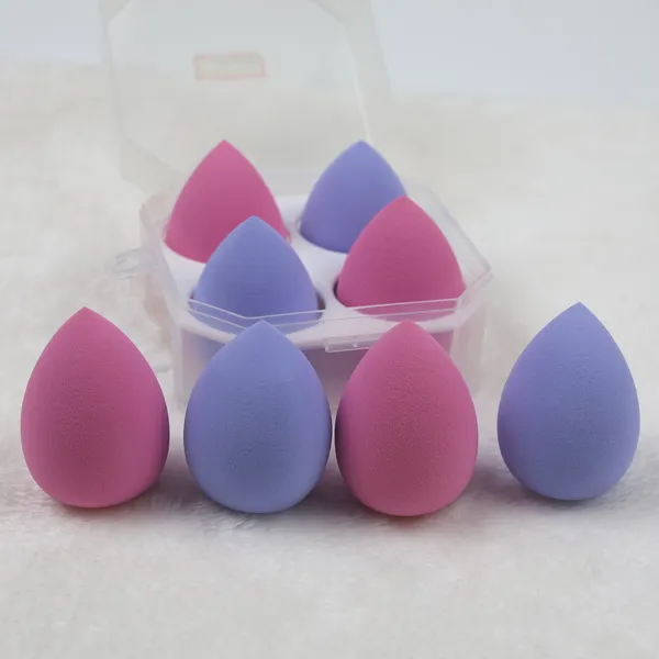 Vegan beauty blender sponges in pink and purple displayed in a PET box