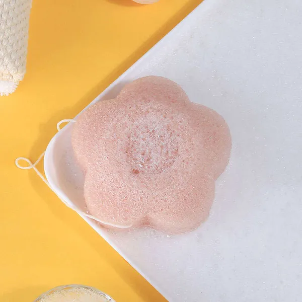 Blossom shaped konjac sponge in vibrant red color